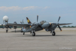 KA114 taxies in following a flight followed by the B-25.