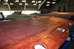 Slightly wider view looking along the top of the port wing towards the fuselage from the outboard flap location. Note the top engine cowling visible.